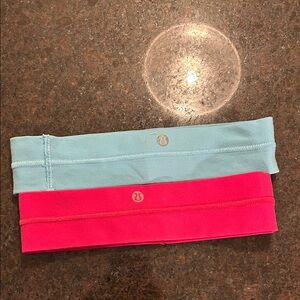 Lululemon Athletica Aqua and Hot pink Headbands both for 18$